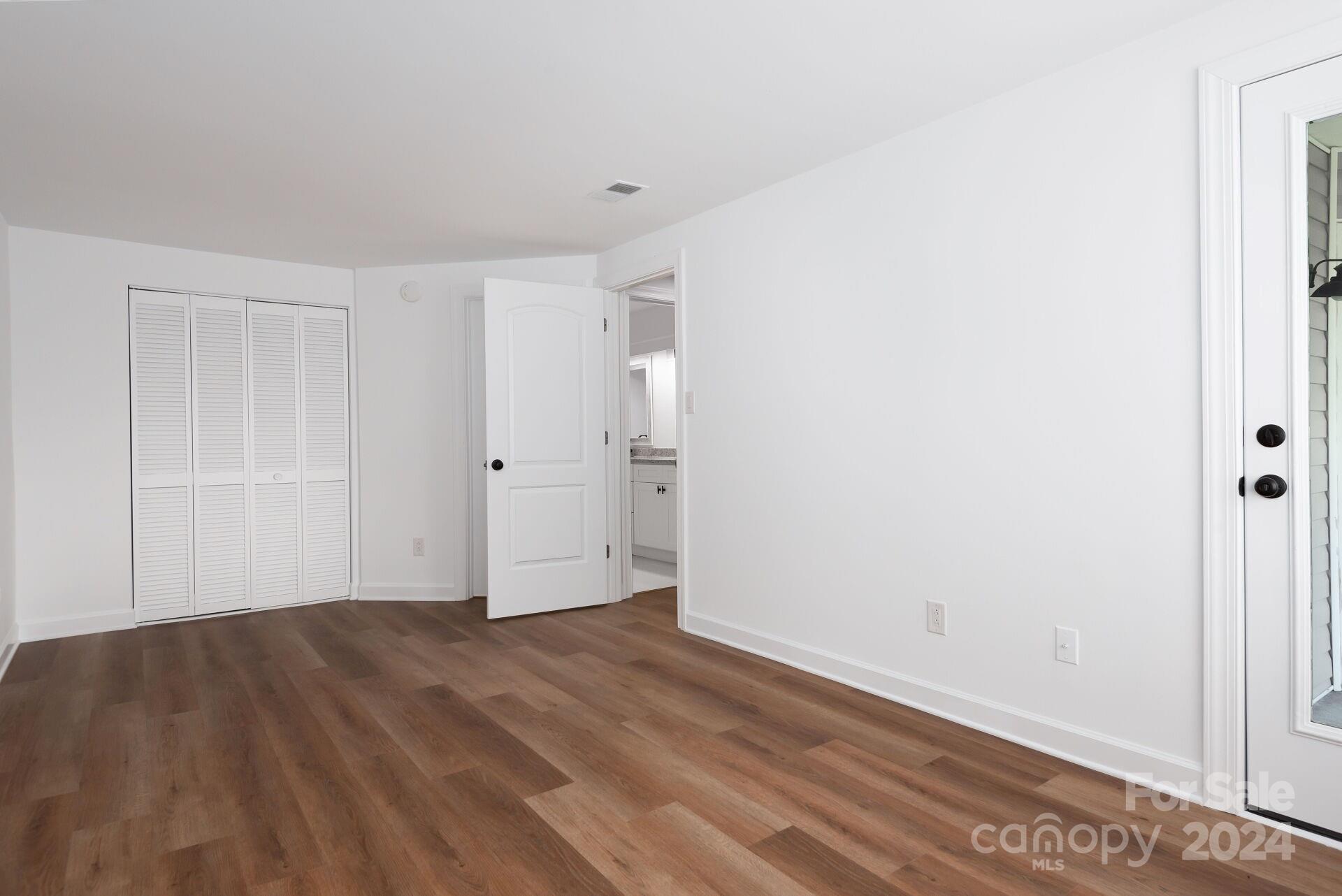 7516 Pebblestone Drive, Unit E Charlotte, NC 28212 - Photo 9 of 21 a view of an empty room