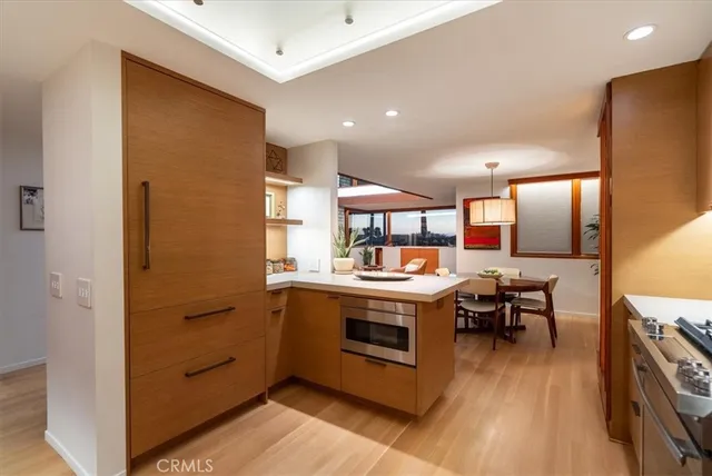 a living room with furniture a rug and a book shelf