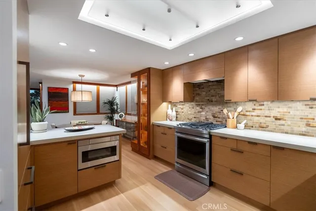 a living room with furniture a window and a flat screen tv