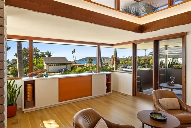 a kitchen with stainless steel appliances granite countertop a sink and a refrigerator