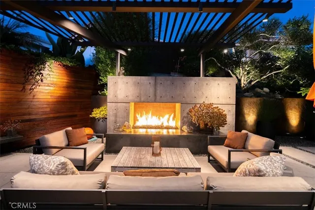 a living room with furniture and a lamp