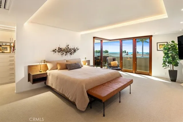 a view of a hallway with wooden floor and stairs