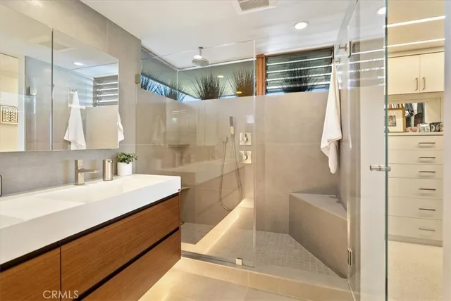 a view of a patio with dining table and chairs with a barbeque grill