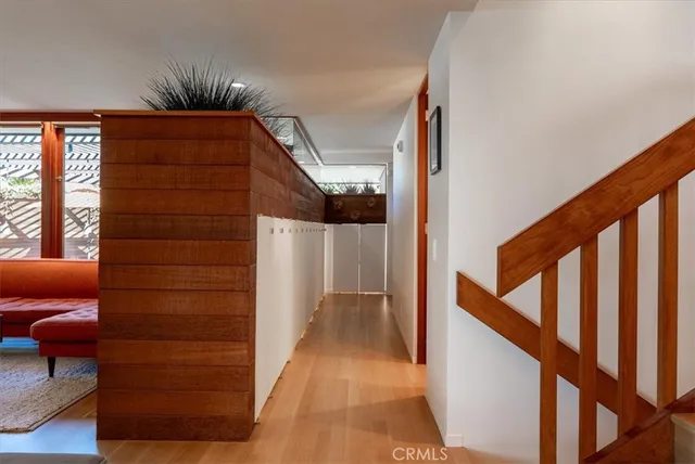 a building outdoor space with patio furniture and potted plants