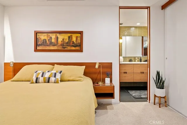 a outdoor space with patio couches and a fireplace