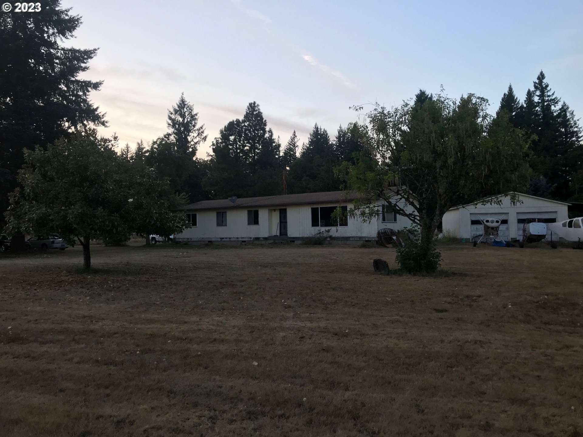 a house with trees in the background