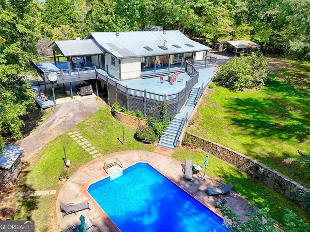 an aerial view of a house with a yard