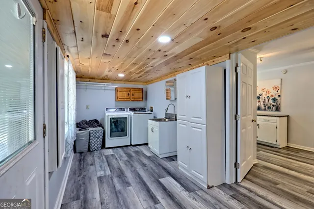 a view of a swimming pool with a patio and wooden floor