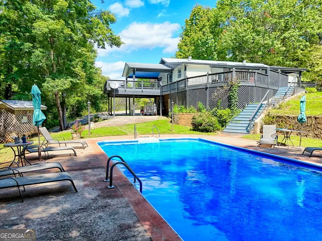 a view of a swimming pool with a patio