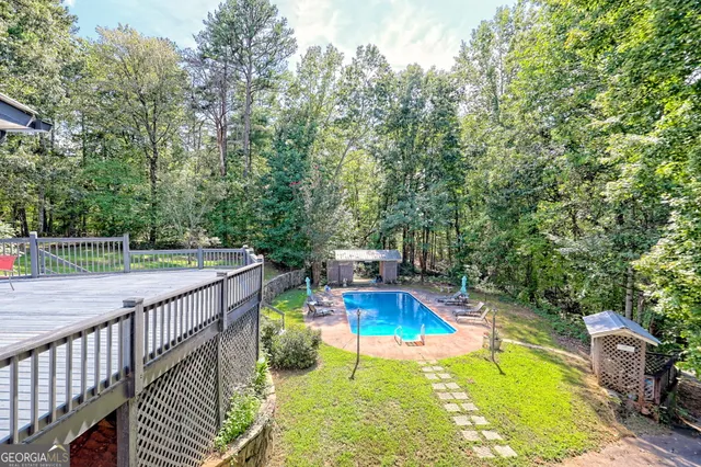 a view of a wooden deck and a yard