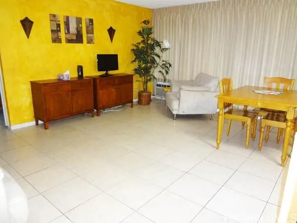 a living room with furniture and a table