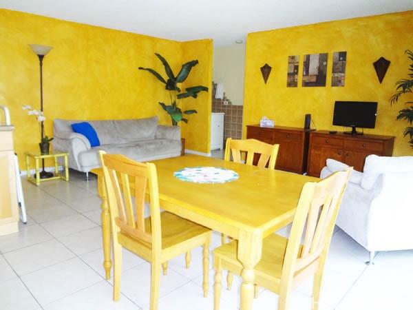 2572 Lemon Road, Unit 306 Honolulu, HI 96815 - Photo 2 of 13 a view of a dining room with furniture and a flat screen tv