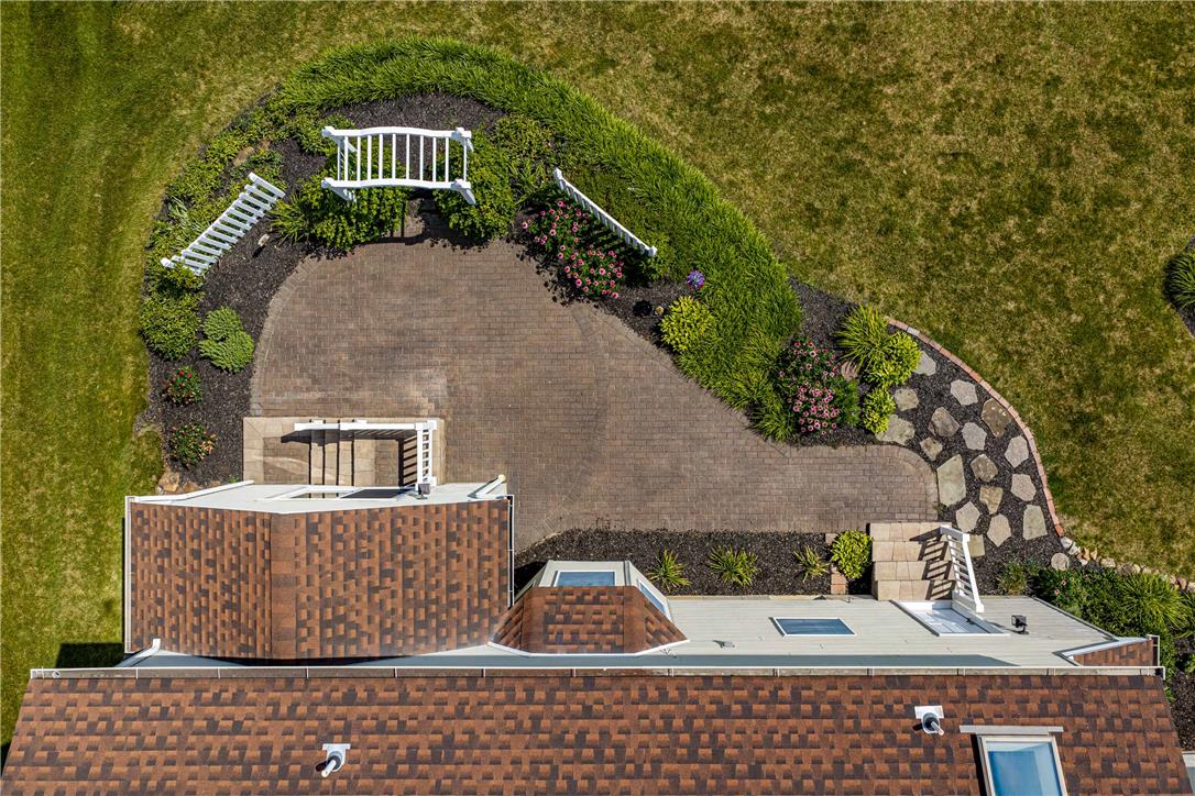 4568 Greenfield Road Bethlehem, PA 18017 - Photo 51 of 59 An aerial perspective reveals a thoughtfully designed backyard with brick patio and landscaped beds.