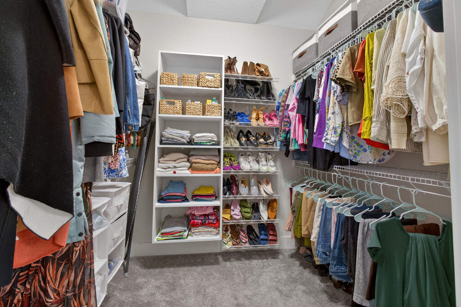 5700 Emily Road Bettendorf, IA 52722 - Photo 35 of 58 a view of walk in closet with clothes and shoes