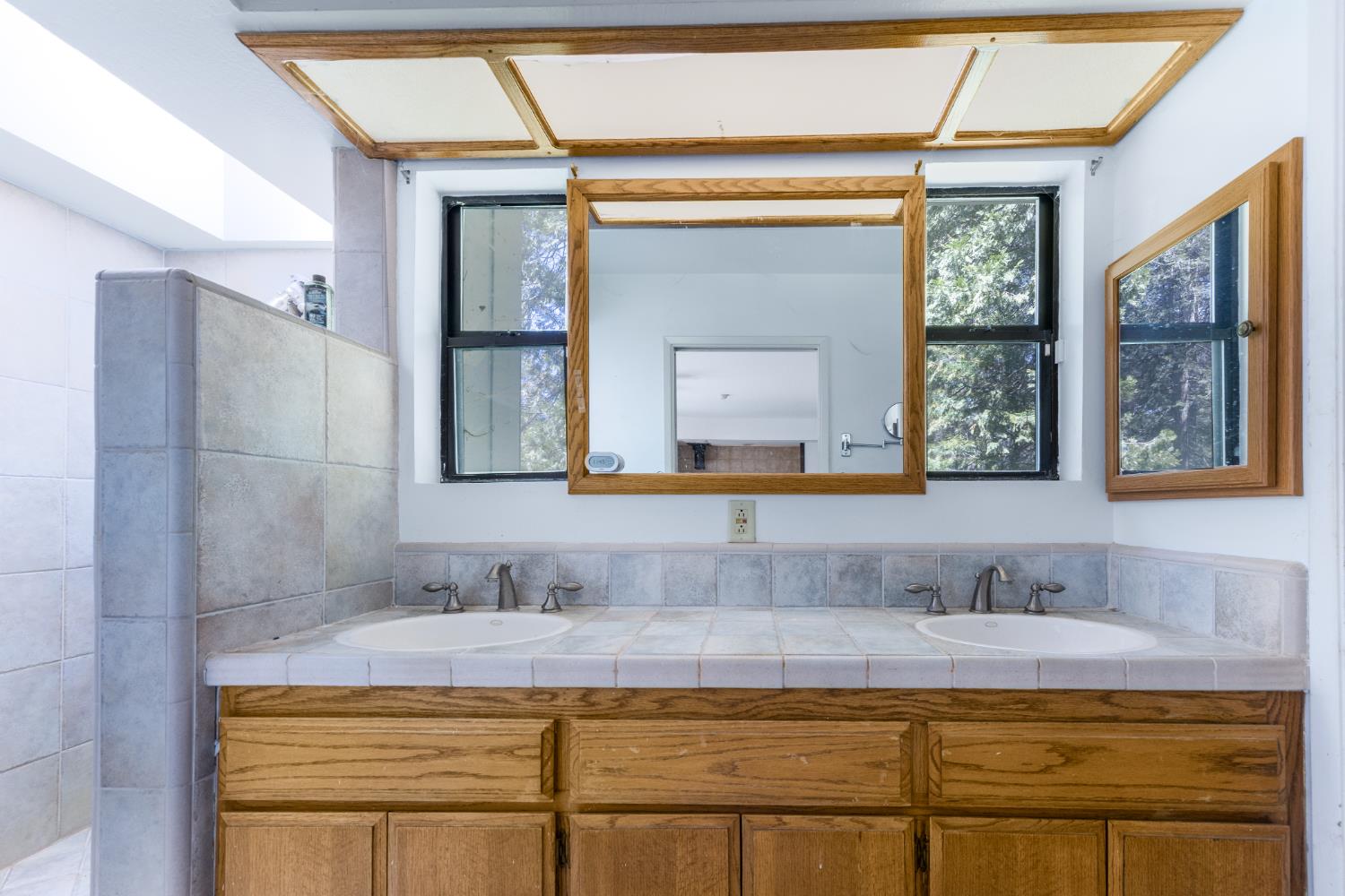 2070 King Of The Mountain Road Pollock Pines, CA 95726 - Photo 14 of 53 a bathroom with a granite countertop sink mirror and double