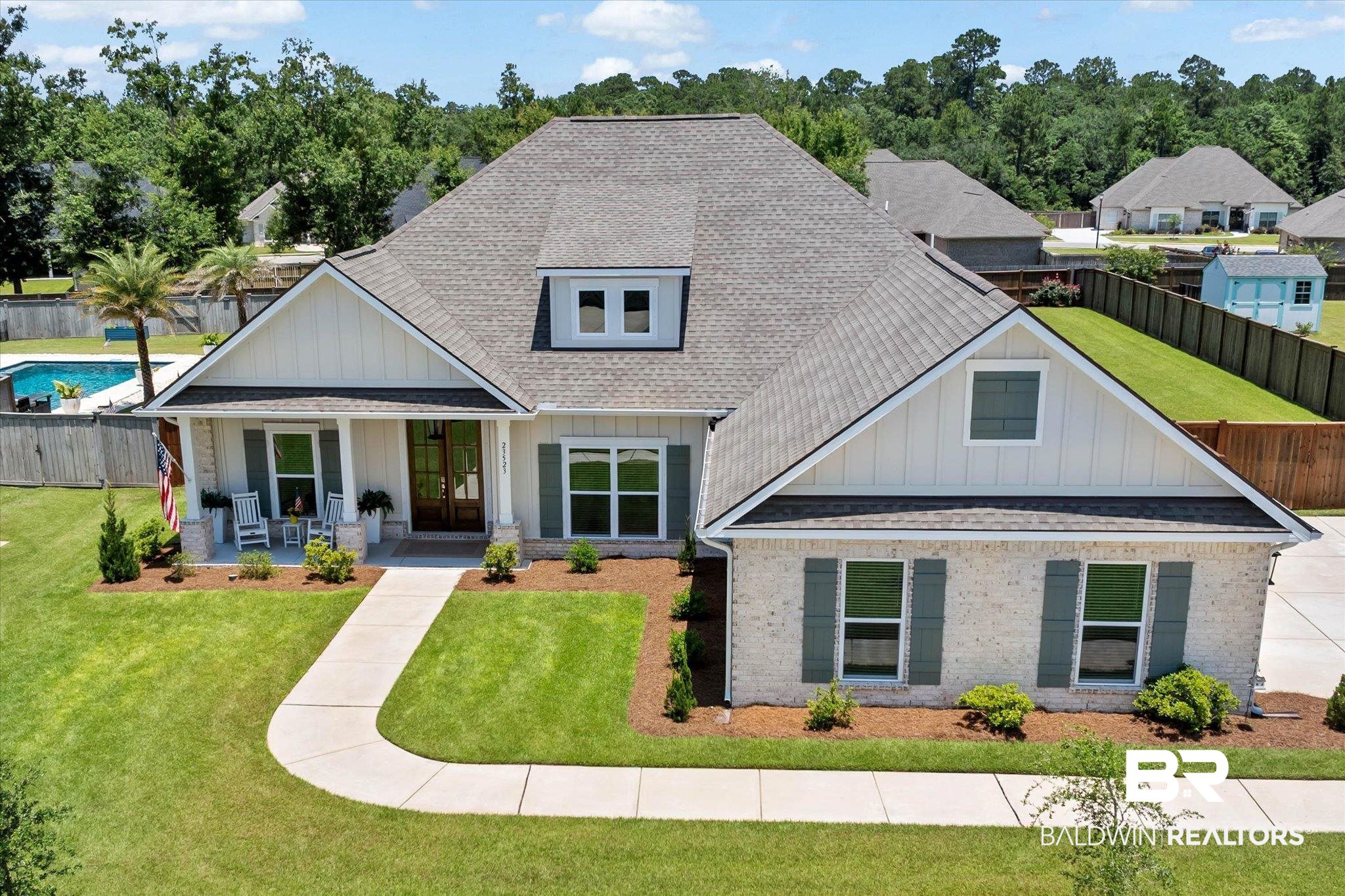 23523 Travis Stock Street Foley, AL 36535 - Photo 1 of 45 Single-story home featuring a light brick facade and board and batten gables