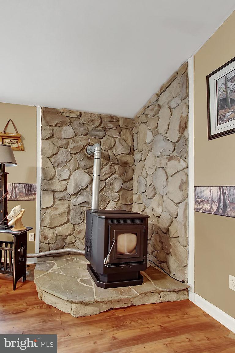 509 River Road Delta, PA 17314 - Photo 13 of 26 Pellet stove in Family Room