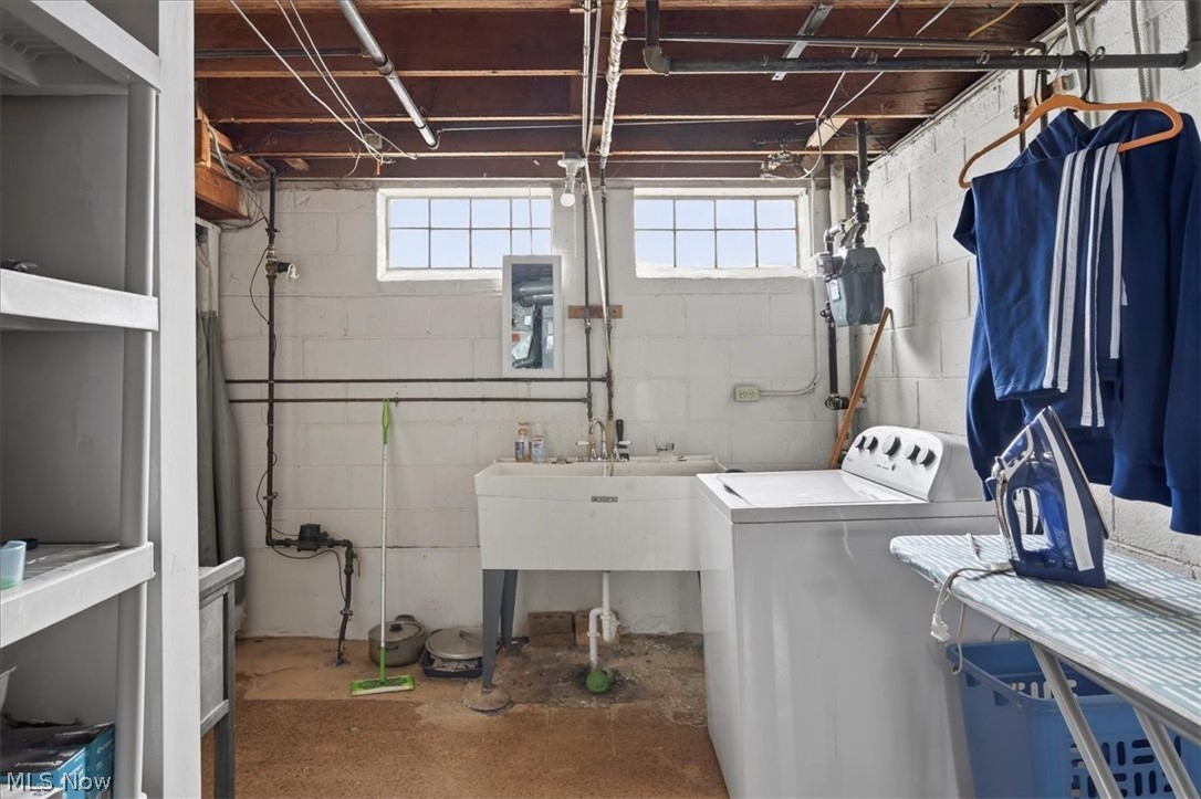 17282 McCracken Road Maple Heights, OH 44137 - Photo 18 of 26 Laundry area with washer / clothes dryer and concrete floors