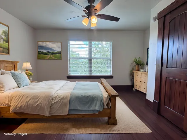 a bedroom with a bed and a window