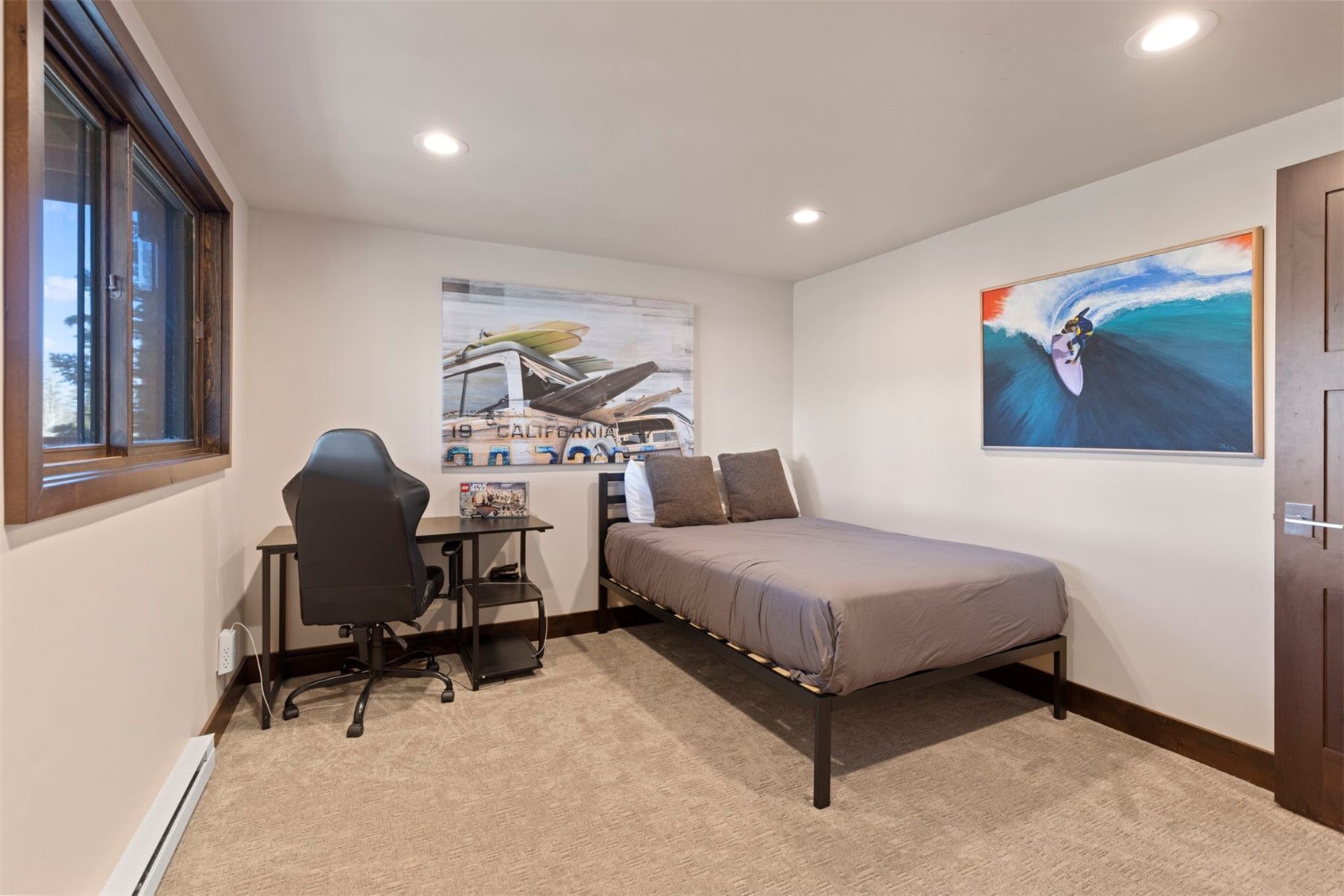103 Bearing Tree Road Breckenridge, CO 80424 - Photo 24 of 30 a spacious bedroom with a bed and a painting on the wall