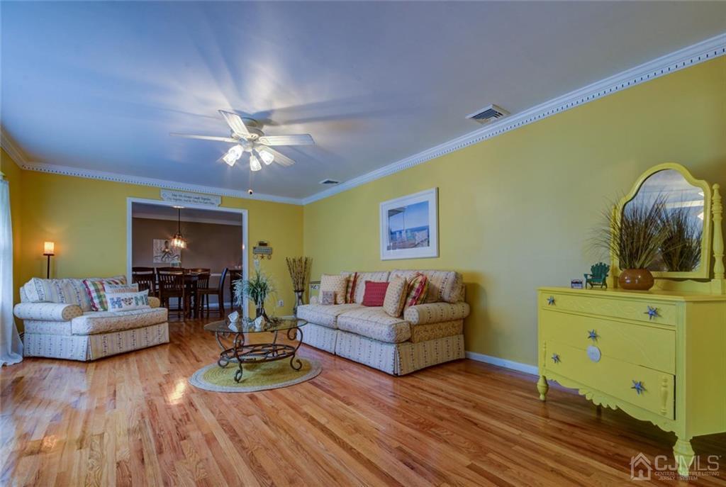 582 Holmdel Road Hazlet, NJ 07730 - Photo 5 of 25 a living room with furniture and wooden floor