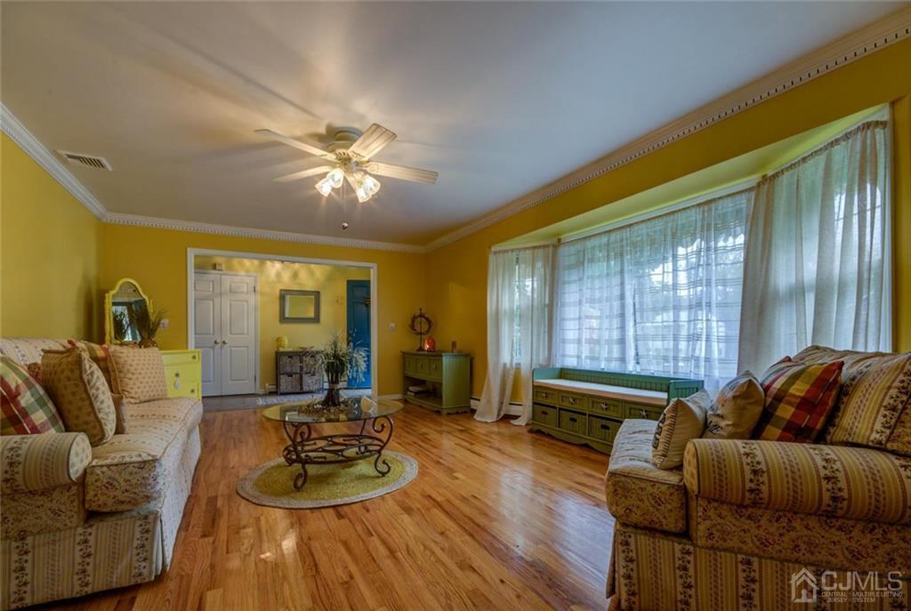 582 Holmdel Road Hazlet, NJ 07730 - Photo 6 of 25 a living room with furniture and a window