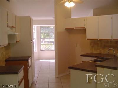 18347 Lee Road Fort Myers, FL 33967 - Photo 8 of 10 a bathroom with a sink and a mirror