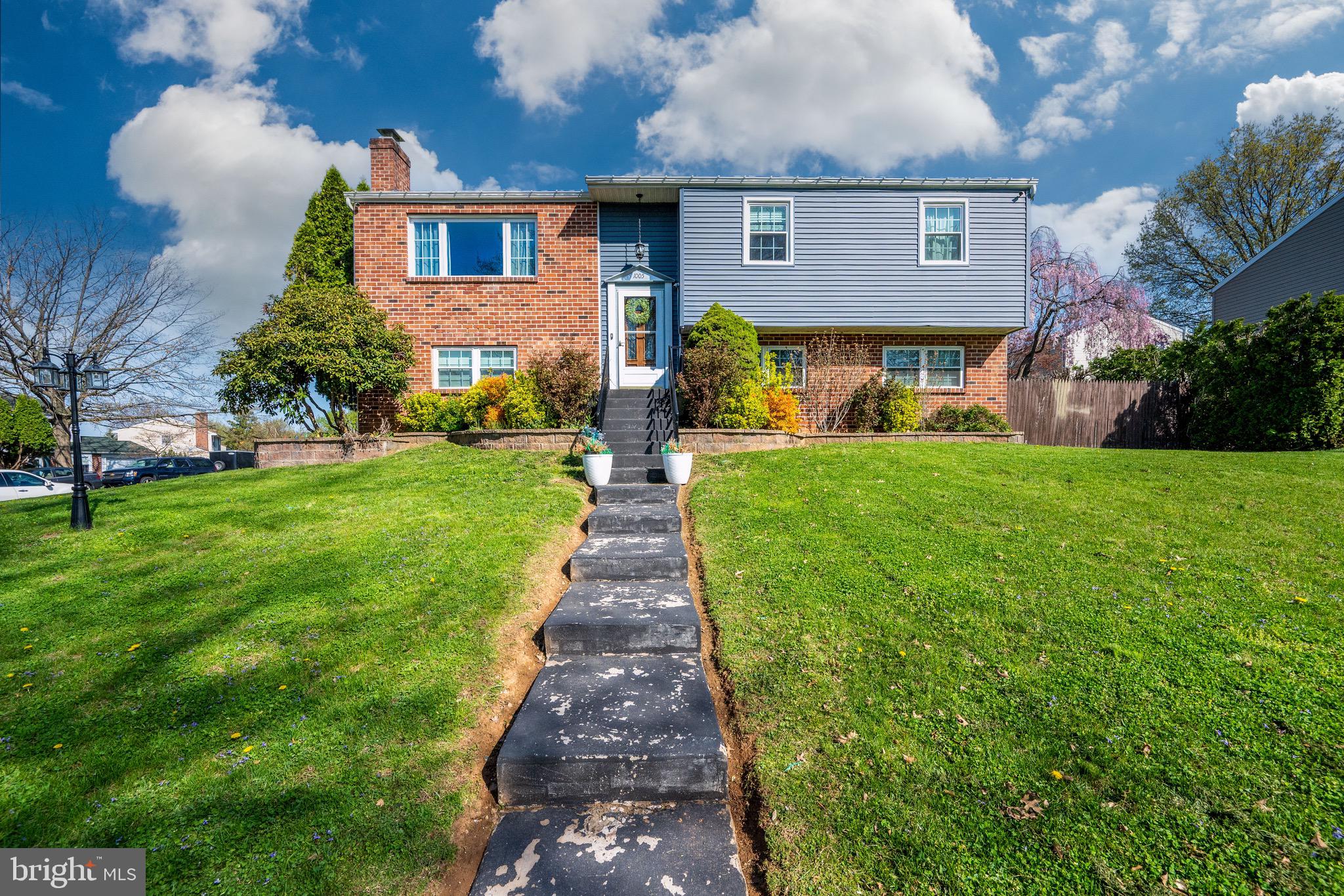 1005 Landover Drive Reading, PA 19605 - Photo 1 of 46 a front view of a house with yard