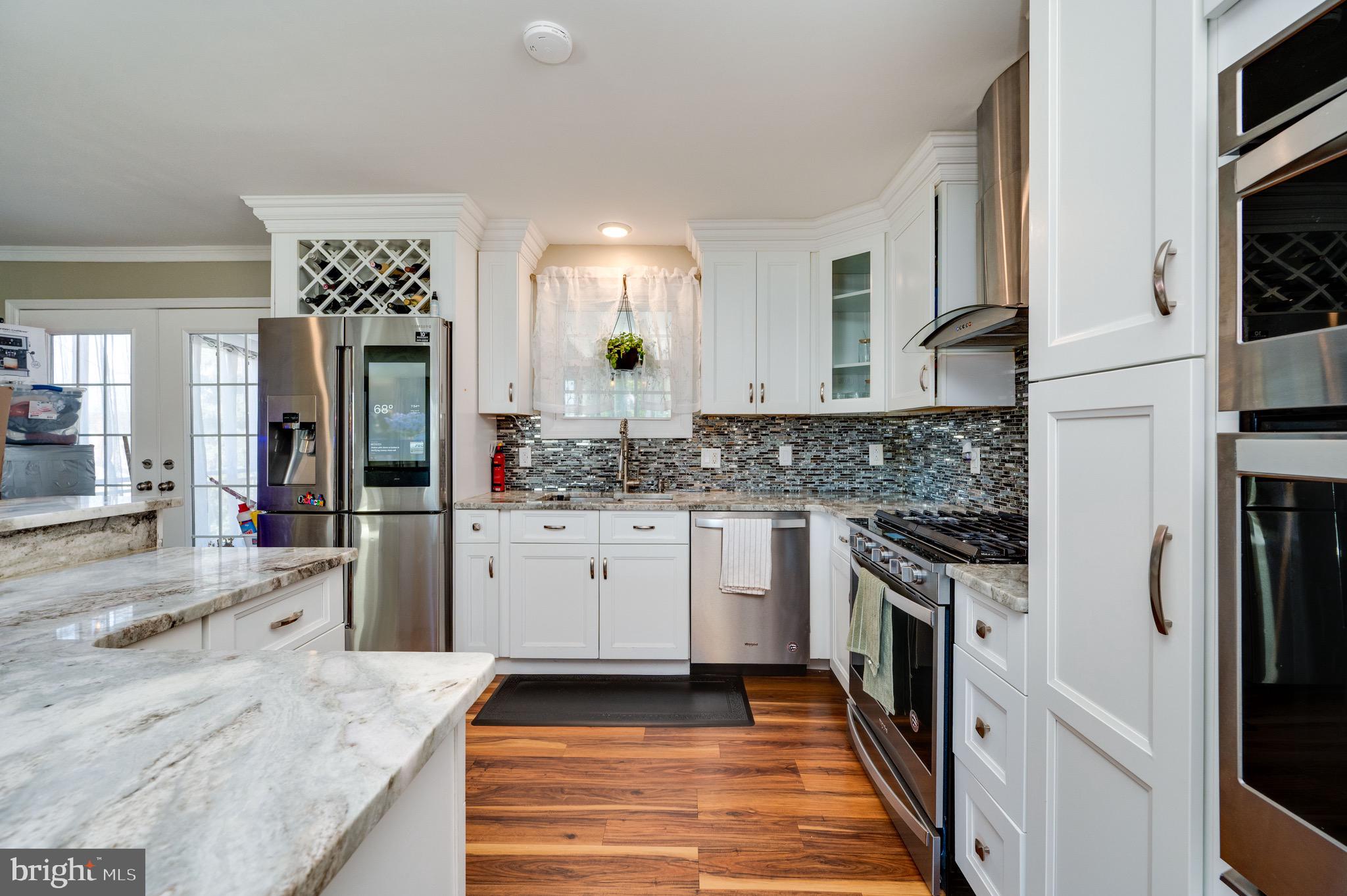 1005 Landover Drive Reading, PA 19605 - Photo 45 of 46 a large kitchen with stainless steel appliances granite countertop a stove a sink and a refrigerator