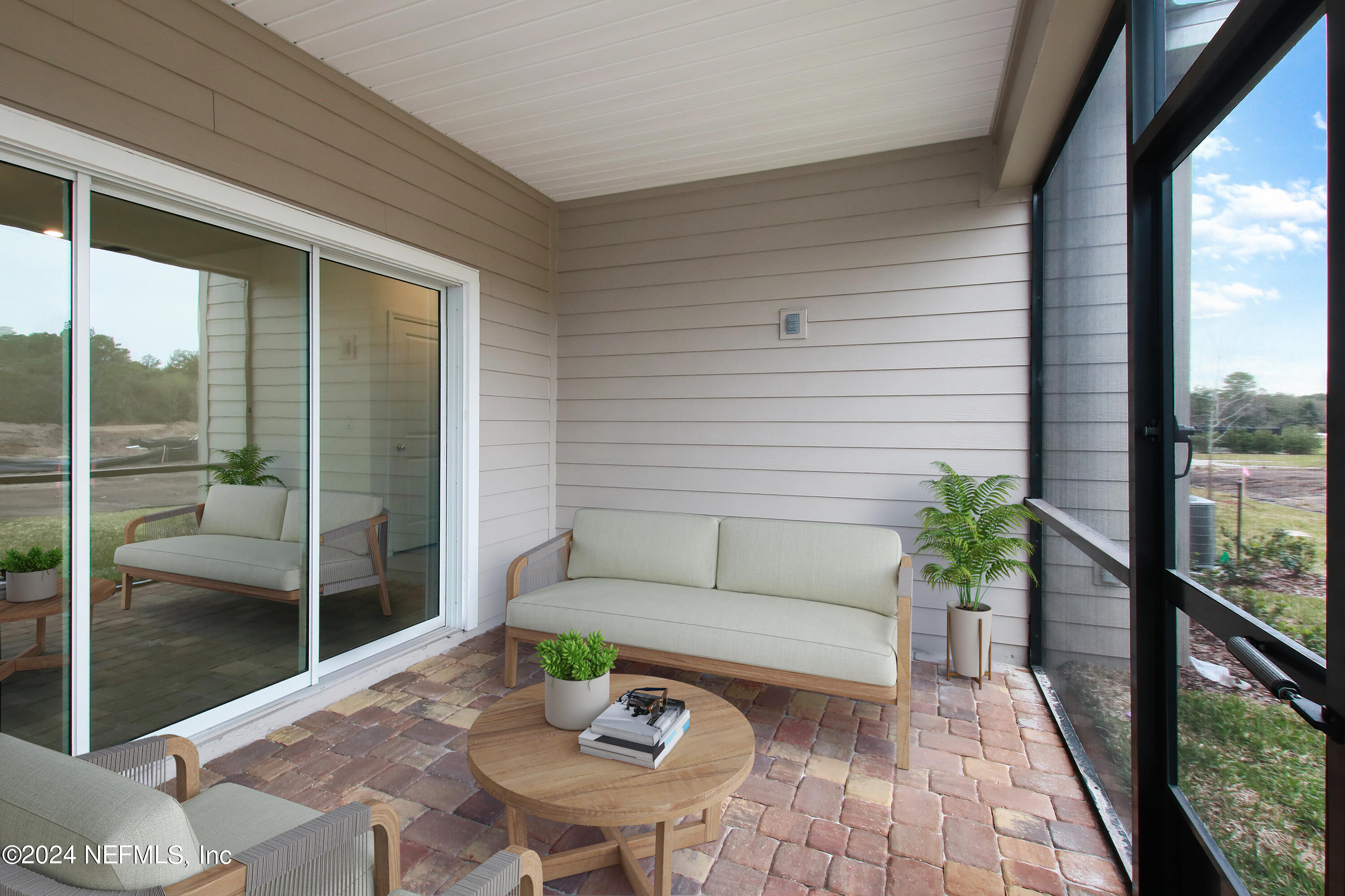 273 Pentwater Road St. Augustine, FL 32092 - Photo 13 of 13 a view of a patio with couches and table and chairs