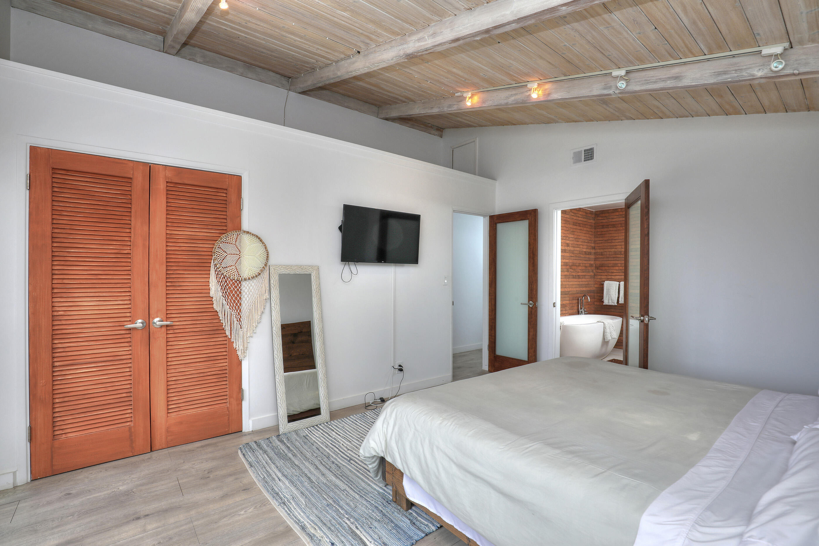 824 Alston Road Santa Barbara, CA 93108 - Photo 14 of 25 a bedroom with a bed and a flat screen tv