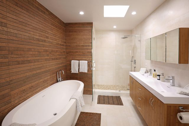 a bathroom with a sink a mirror and a bathtub