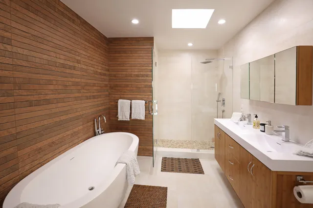 a bathroom with a sink a mirror and a bathtub