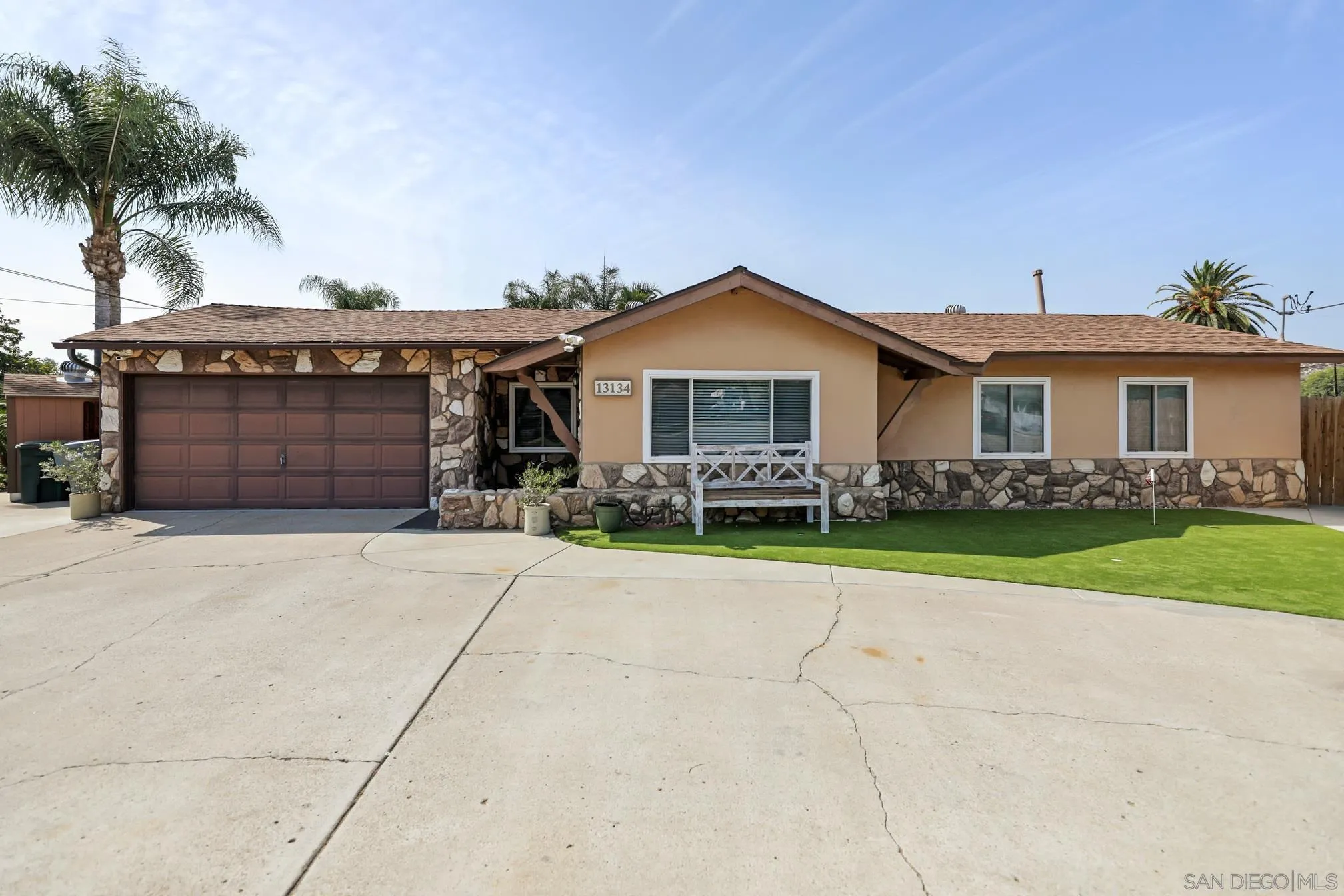 13134 Acton Avenue Poway, CA 92064 - Photo 1 of 37 a front view of a house with a yard and garage