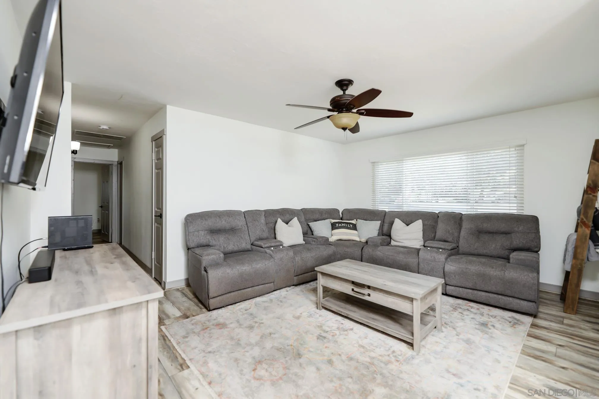 13134 Acton Avenue Poway, CA 92064 - Photo 19 of 37 a living room with furniture and a large window