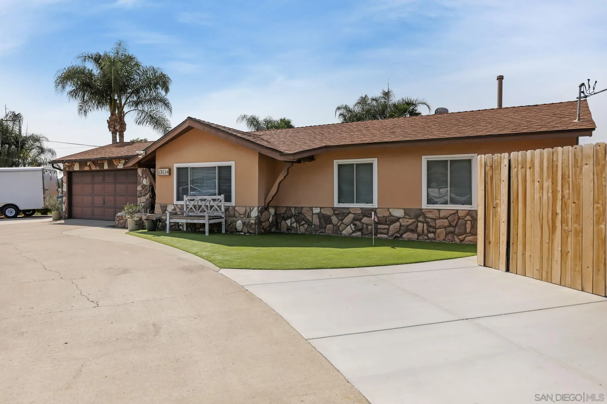 13134 Acton Avenue Poway, CA 92064 - Photo 2 of 37 a front view of a house with a yard and garage