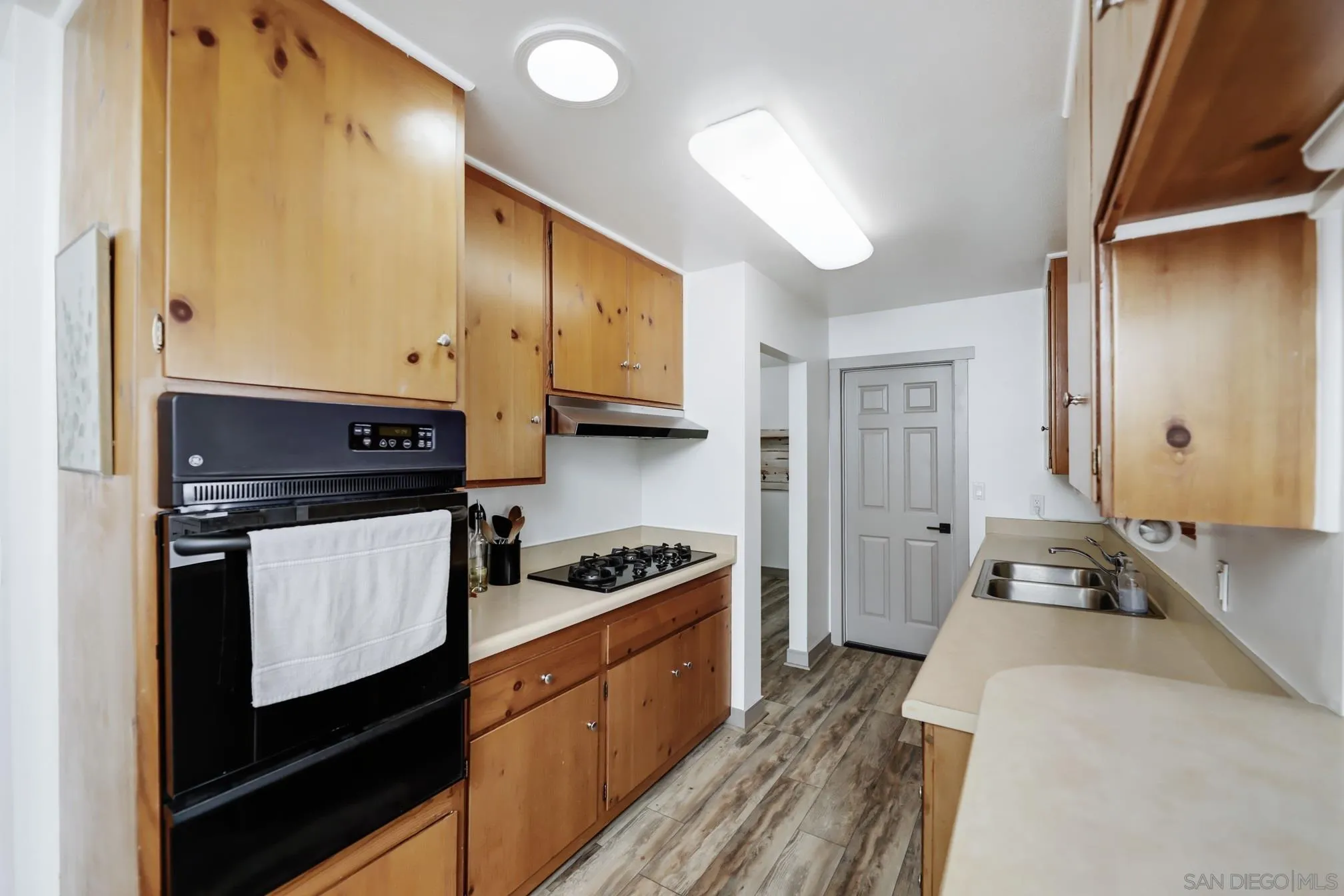 13134 Acton Avenue Poway, CA 92064 - Photo 24 of 37 a kitchen with stainless steel appliances a stove a sink and a refrigerator
