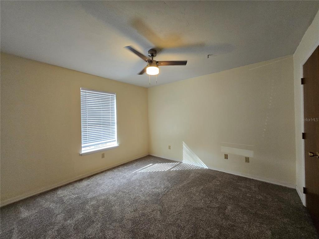 2360 Southwest Archer Road, Unit 604 Gainesville, FL 32608 - Photo 11 of 16 a view of an empty room with a window