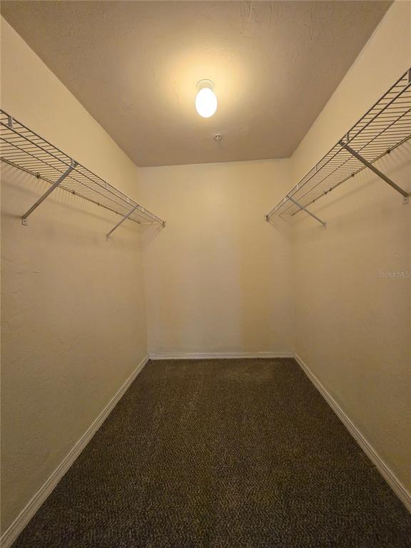 2360 Southwest Archer Road, Unit 604 Gainesville, FL 32608 - Photo 12 of 16 a view of a room with racks on the wall