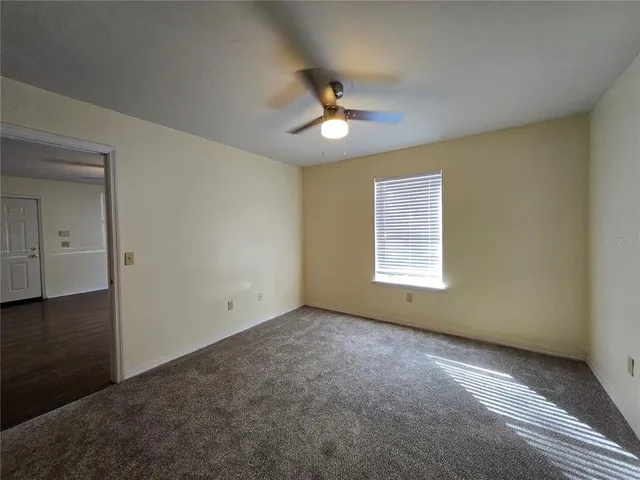 a bathroom with a toilet sink and shower