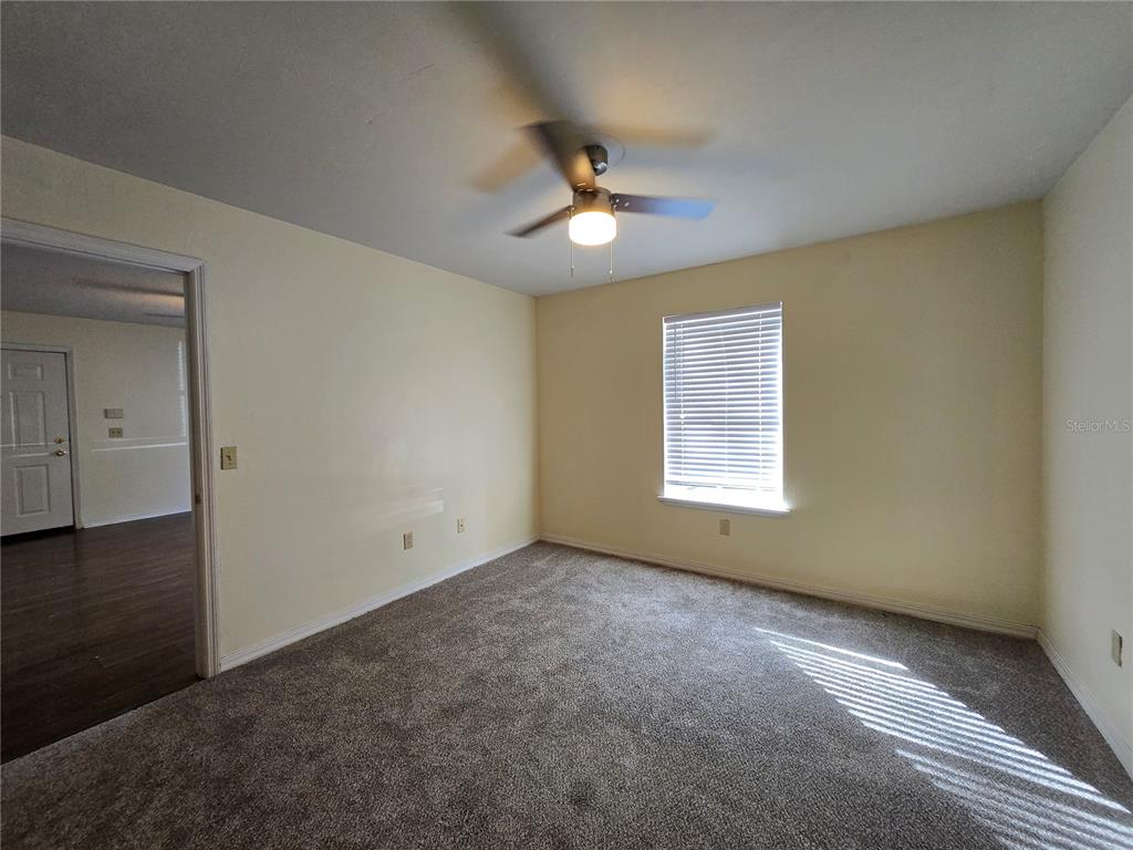 2360 Southwest Archer Road, Unit 604 Gainesville, FL 32608 - Photo 13 of 16 a view of an empty room with a window