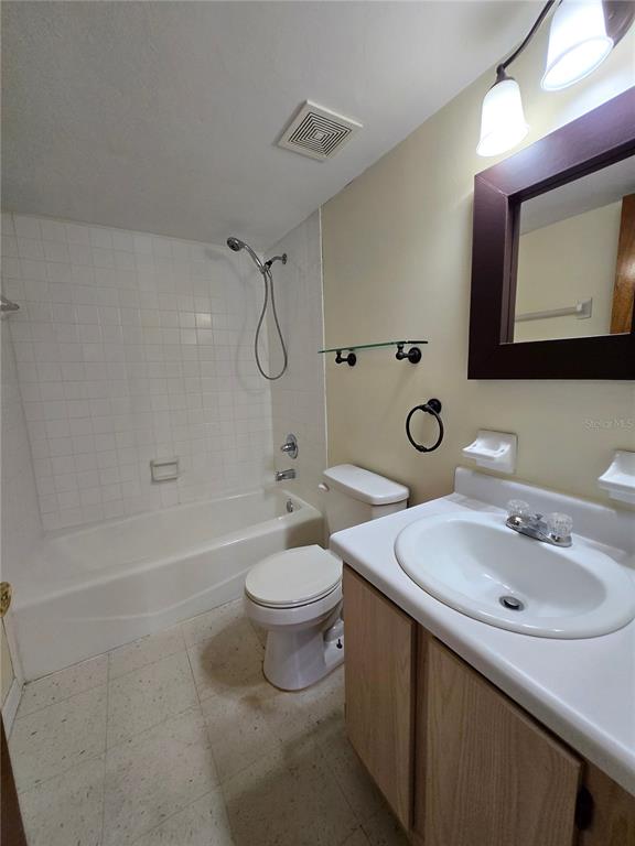 2360 Southwest Archer Road, Unit 604 Gainesville, FL 32608 - Photo 15 of 16 a bathroom with a sink and a mirror