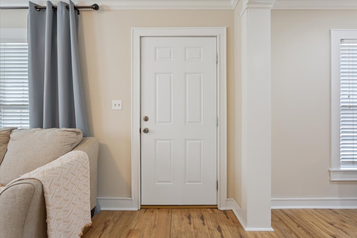 1607 North Harding Avenue Cameron, TX 76520 - Photo 7 of 37 Enter into a well-lit living space with durable hardwood flooring.