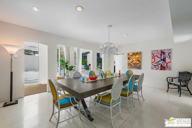 a kitchen with stainless steel appliances a sink window and cabinets