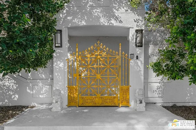 a view of a building with a backyard patio and swimming pool