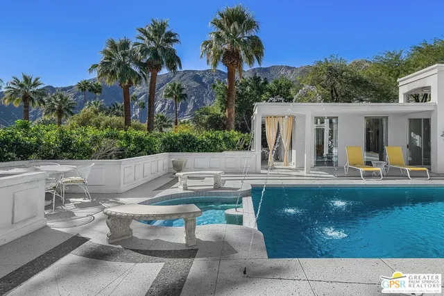 a view of a house with swimming pool