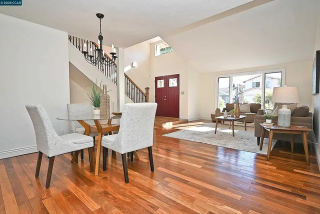 a view of a dining room with furniture window and wooden floor