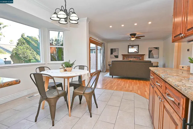 a view of a dining room with furniture window and outside view