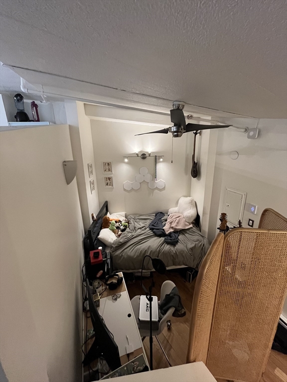 12 Stoneholm Street, Unit 322 Boston, MA 02115 - Photo 11 of 33 a bed room with furniture and a air conditioner