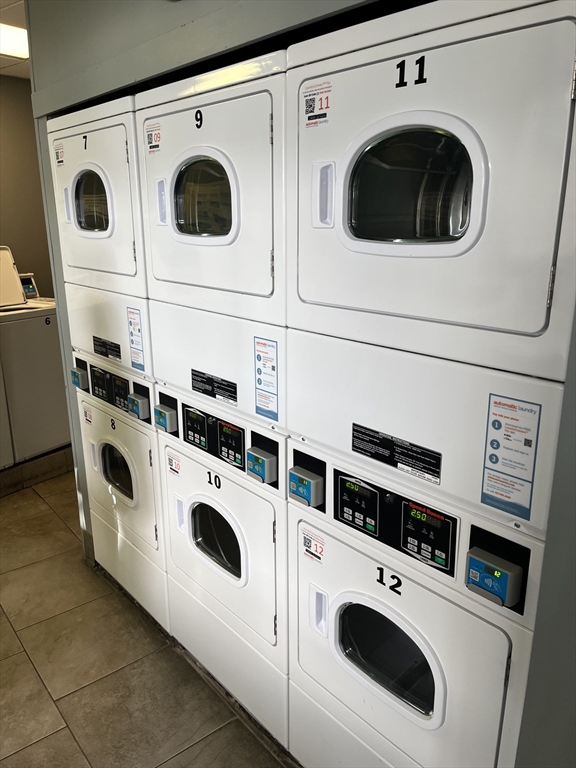 12 Stoneholm Street, Unit 322 Boston, MA 02115 - Photo 23 of 33 a utility room with dryer and washer
